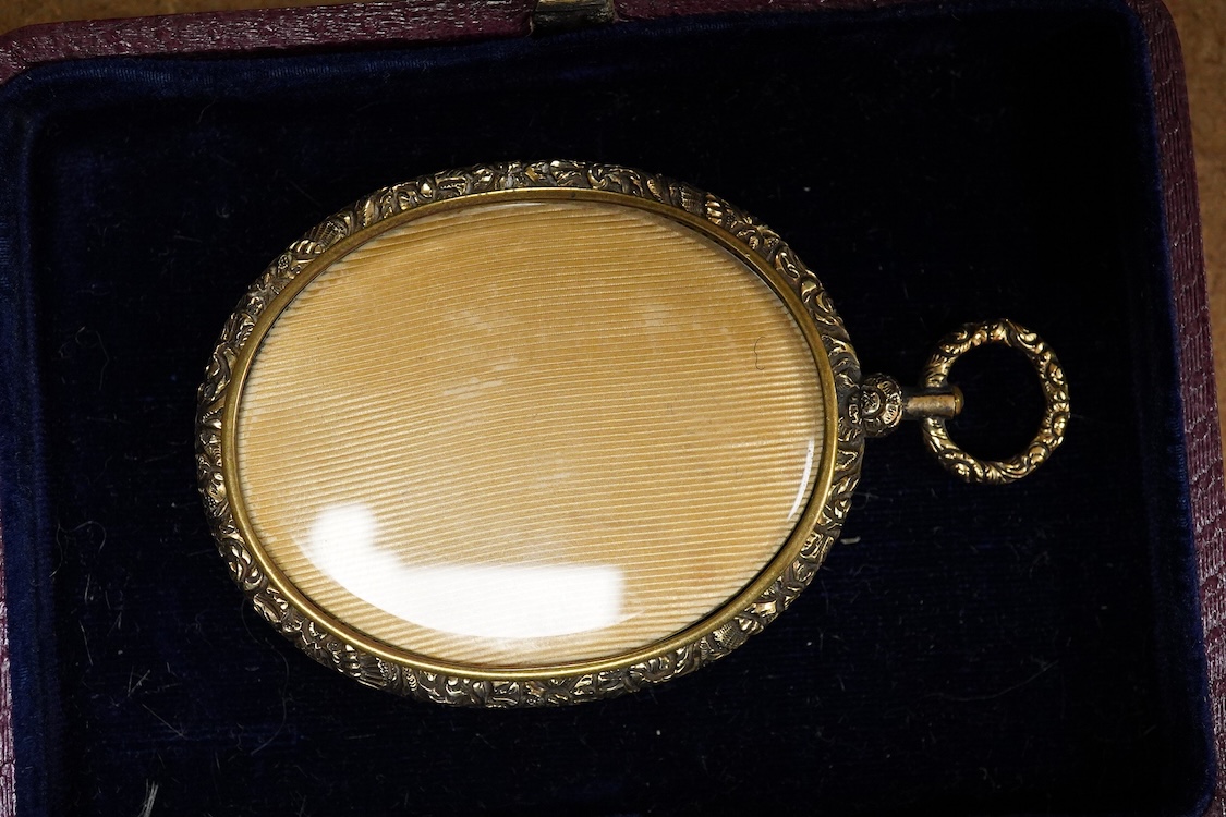 19th century School, portrait miniature of a young gentleman, oval watercolour on ivory, housed in a gilt metal pendant frame, 5 x 4cm CITES Submission reference W16LUUNZ